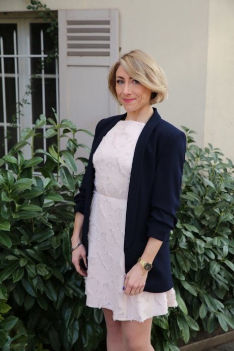 Older French woman wears a bra and tan stocking s while riding on top a dick