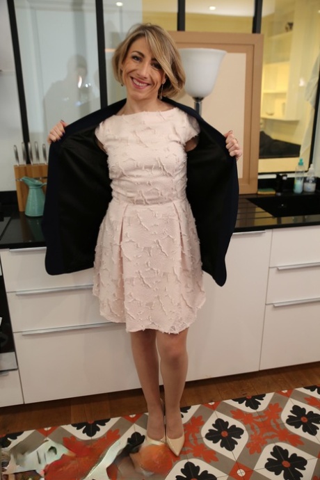 Older French woman wears a bra and tan stocking s while riding on top a dick