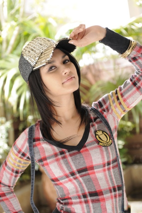 Hot dark haired MILF Maria Ozawa poses seductively outdoors in sexy shorts