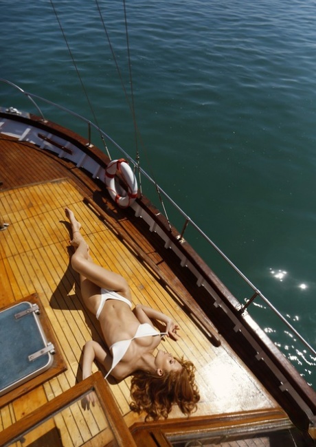 Exotic playboy babe with freckles Valeria Lakhina posing naked on the sea