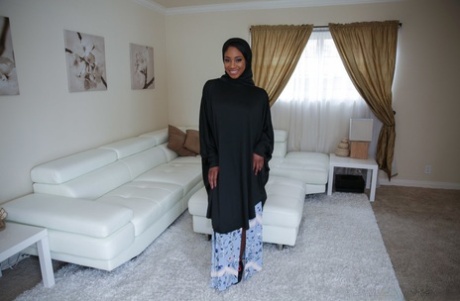Beautiful ebony in a hijab Lala Ivey flashes medium tits & spreads her legs