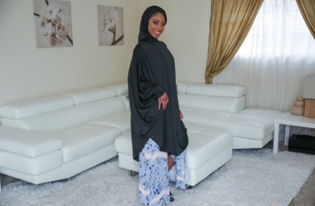 Beautiful ebony in a hijab Lala Ivey flashes medium tits & spreads her legs