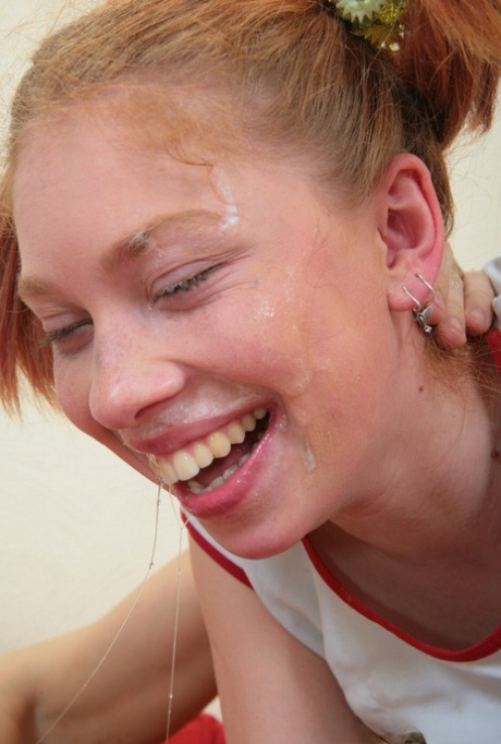 Young redhead wears her hair in pigtails during extreme oral fucking