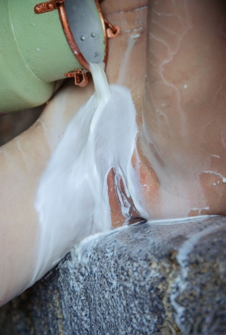 Hot teen Mila pours a jug of milk over her sensational body