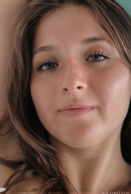 Nice teen Aurora Fox takes off a red bra and thong to pose totally naked