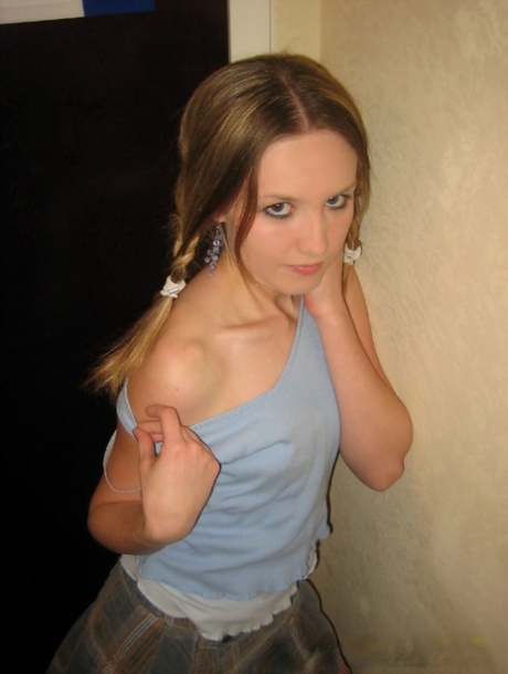 Adorable teen Kitty Kim strips naked behind a closed hotel room door