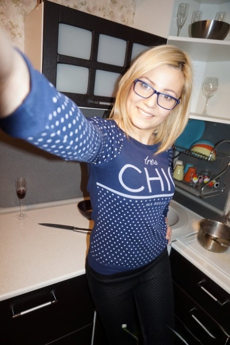 Naughty blonde amateur shows her lovely tits & takes selfies around the house