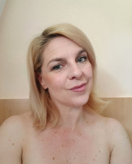 Beautiful mature amateur shows her hot curves while drinking a morning coffee