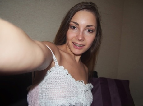 Beautiful amateur teen goes topless to take selfies of her big natural boobs