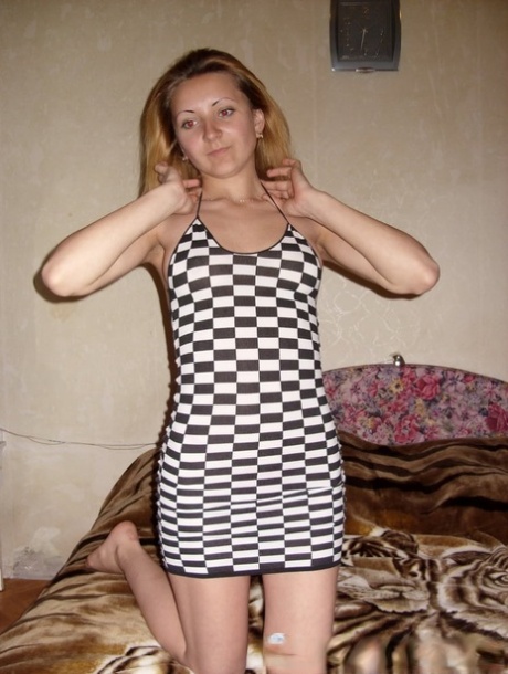 Skinny amateur plays with her sex toys in a hot striptease on the bed