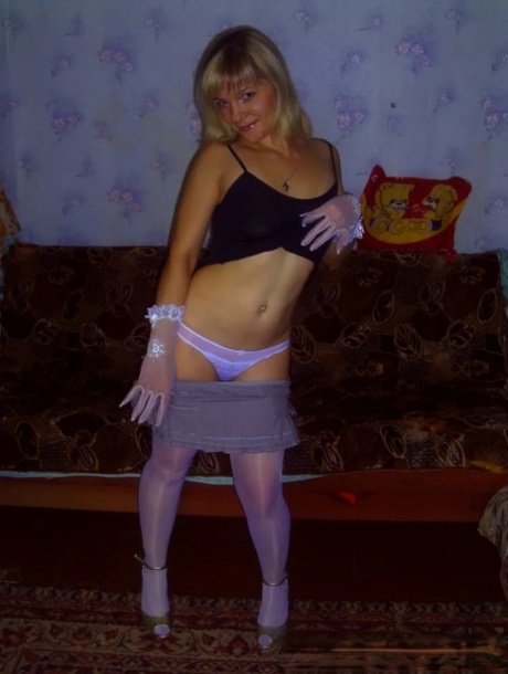 Blonde beauty strips in a solo and shows her tiny tits and big ass