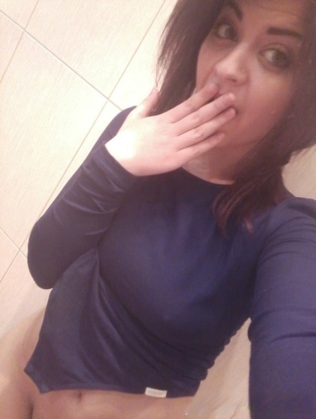 Gorgeous amateur babe takes selfies of her sexy boobs and inked body