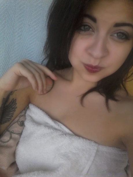 Gorgeous amateur babe takes selfies of her sexy boobs and inked body