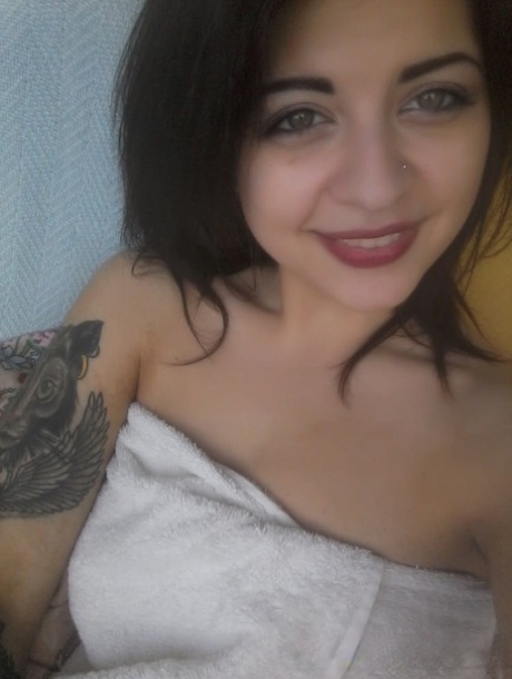 Gorgeous amateur babe takes selfies of her sexy boobs and inked body