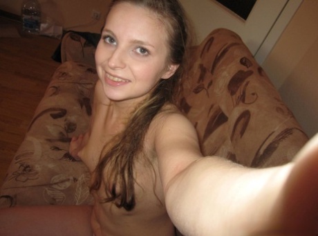 Sensational teen takes hot selfies while posing naked in her living room