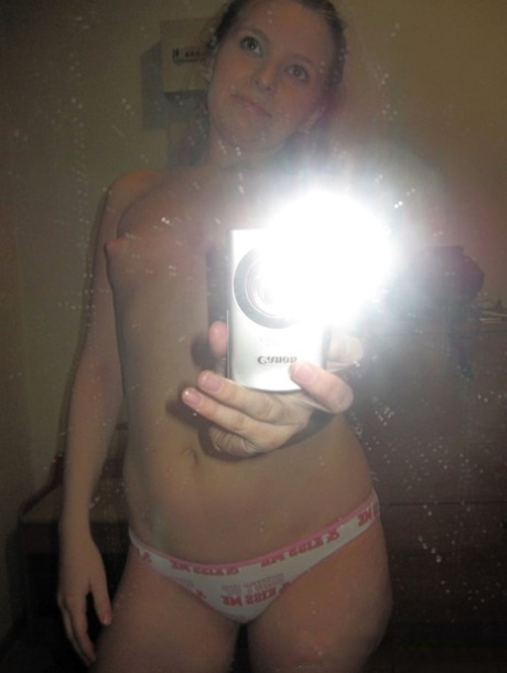 Sensational teen takes hot selfies while posing naked in her living room