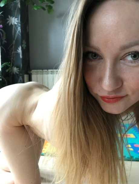 Skinny amateur MILF Katlynn takes sexy naked selfies while spreading her pussy