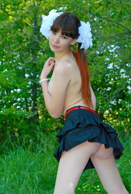 18-year-old schoolgirl peels on a blanket outdoors & shows her big ass & holes