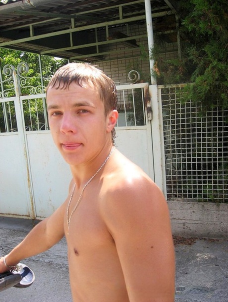 Amateur girl with red hair changes into a bikini before getting in the ocean