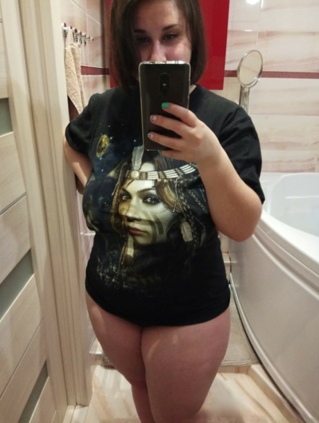 Chubby amateur brunette shows off her monster natural tits and ass