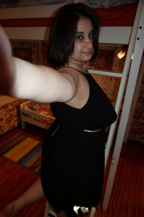 Chubby amateur brunette shows off her monster natural tits and ass