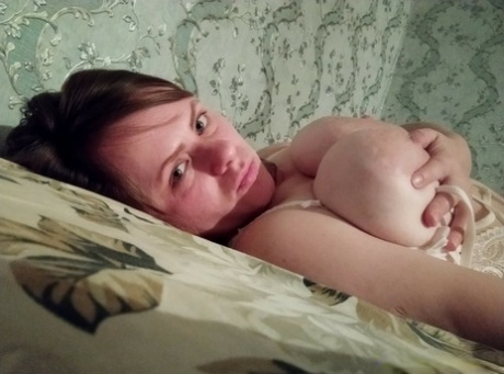 Naughty amateur flaunts her incredible big tits and nice ass in lingerie