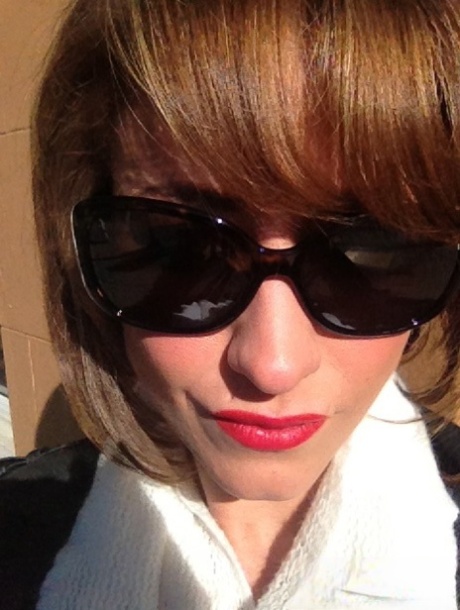 Cougar Eva Notty poses in her Xmas outfit before getting her huge tits jizzed