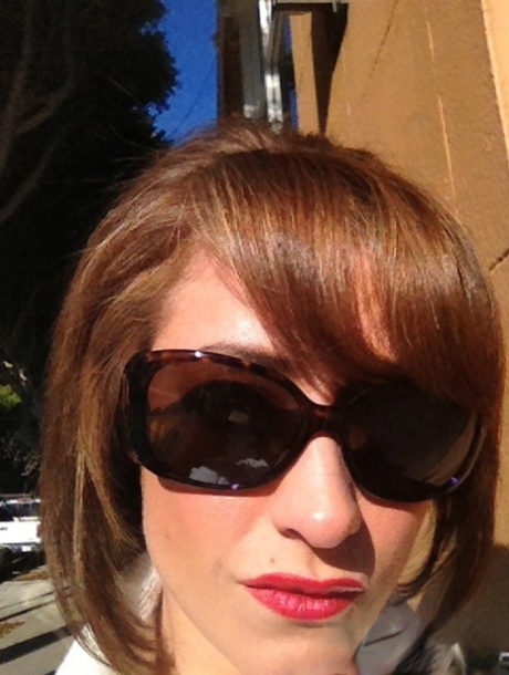 Cougar Eva Notty poses in her Xmas outfit before getting her huge tits jizzed