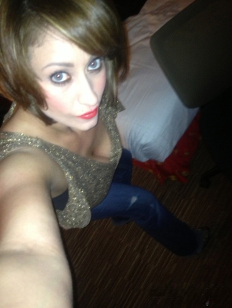 Cougar Eva Notty poses in her Xmas outfit before getting her huge tits jizzed