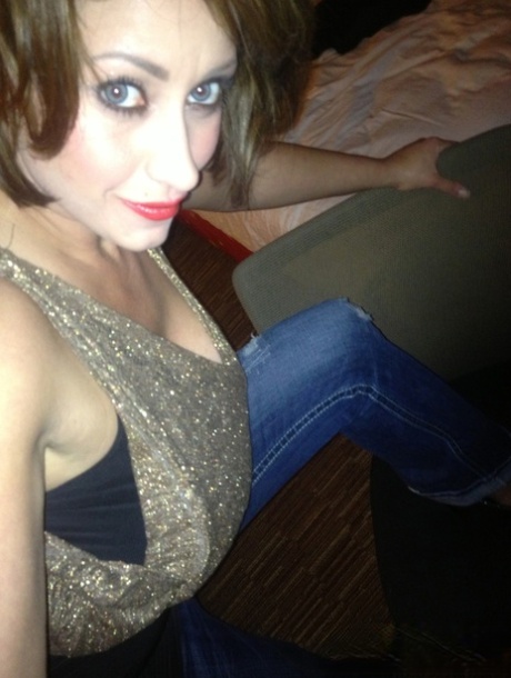 Cougar Eva Notty poses in her Xmas outfit before getting her huge tits jizzed