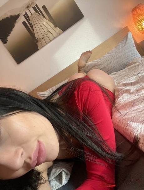 Black haired beauty Sasha Sparrow slowly unveils her tiny tits and tasty cunt