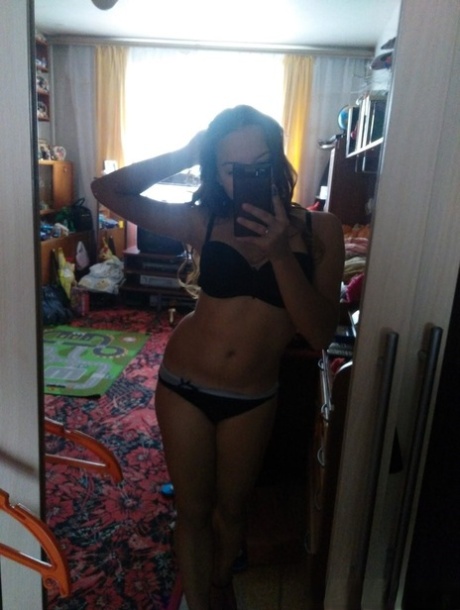 Naughty amateur teen poses in the mirror for selfies in hot outfits & lingerie