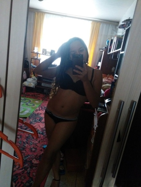Naughty amateur teen poses in the mirror for selfies in hot outfits & lingerie