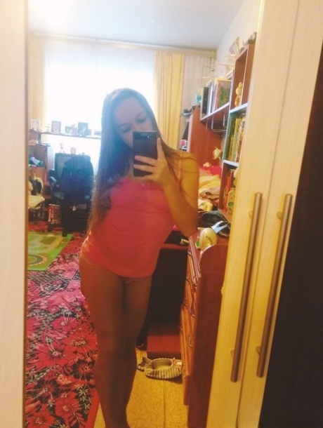 Naughty amateur teen poses in the mirror for selfies in hot outfits & lingerie