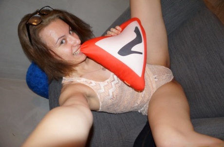 Brunette amateur shows off her lovely tiny tits while taking nude selfies