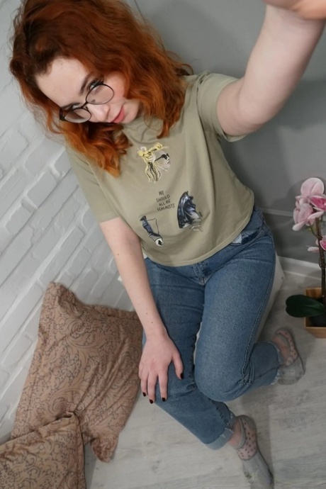 Lovely redhead takes nude selfies showing her juicy tits & her big ass