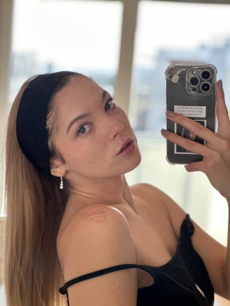 Glamorous OnlyFans babe All About Diana posing provocatively in a solo