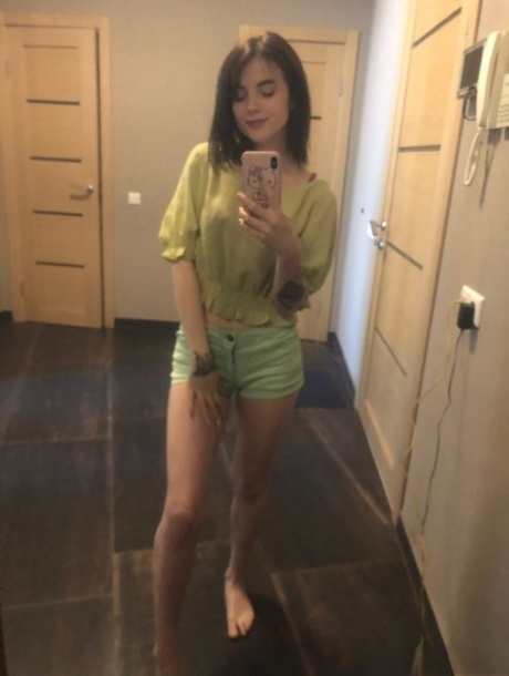 Sweet inked teen Morena Marianotarta strips naked and poses in the mirror