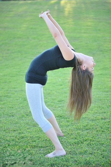 Nerdy teen girl takes off her yoga pants to expose her tight ass and bald cunt