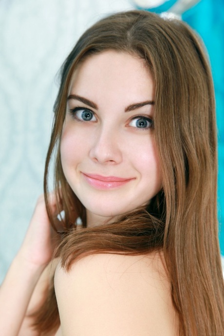 Adorable teen Marta E shows her magnificent big tits and poses nude