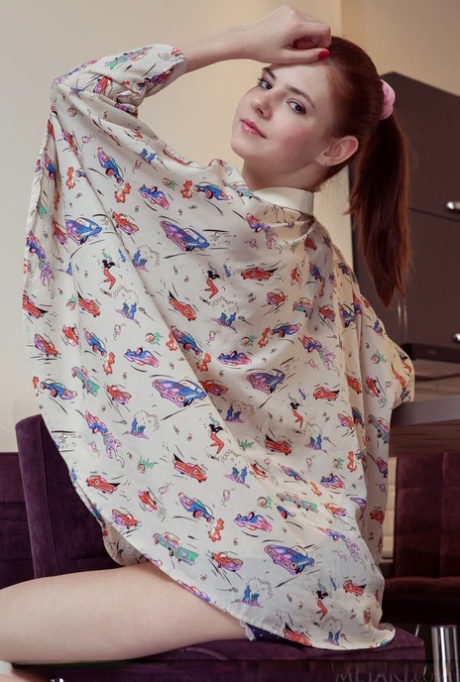 Young redhead Juliett Lea shows her pink twat after stripping to socks