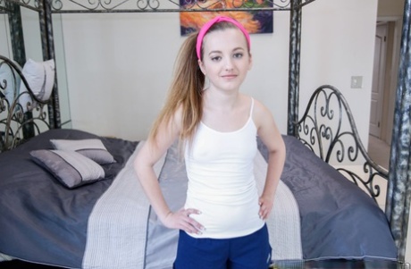 Petite brunette teen Marissa Mae showcasing her round ass and spreading