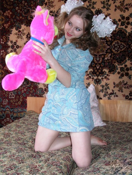 Barely legal teen Anya undresses in her bedroom and masturbates with a toy