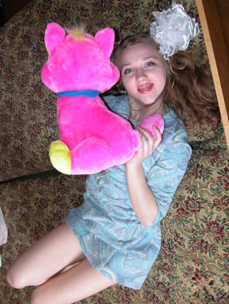 Barely legal teen Anya undresses in her bedroom and masturbates with a toy