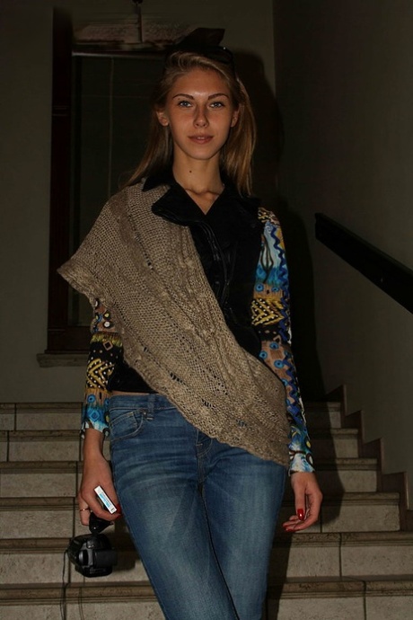 Slim amateur uncovers her small tits in blue jeans during homemade action