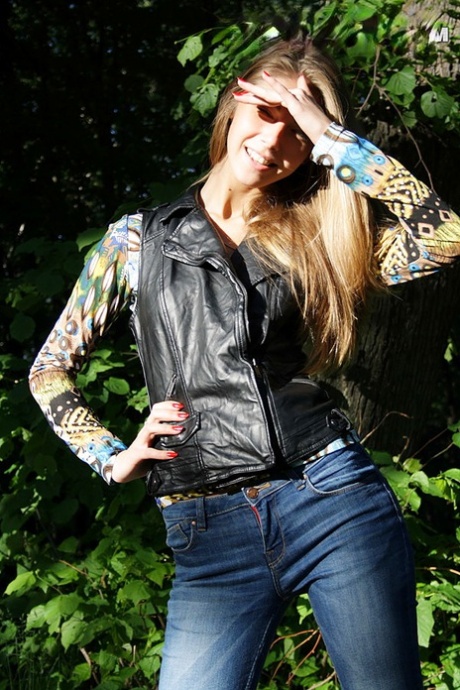 Slim amateur uncovers her small tits in blue jeans during homemade action