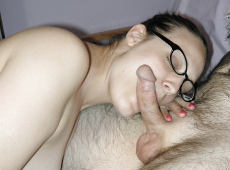 Ponytailed MILF in glasses treats a hairy guy to a sizzling blowjob