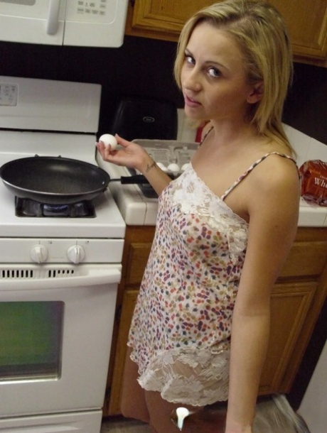 Pretty amateur wife Katty West strips and shows her big tits while cooking