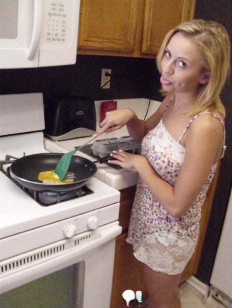 Pretty amateur wife Katty West strips and shows her big tits while cooking