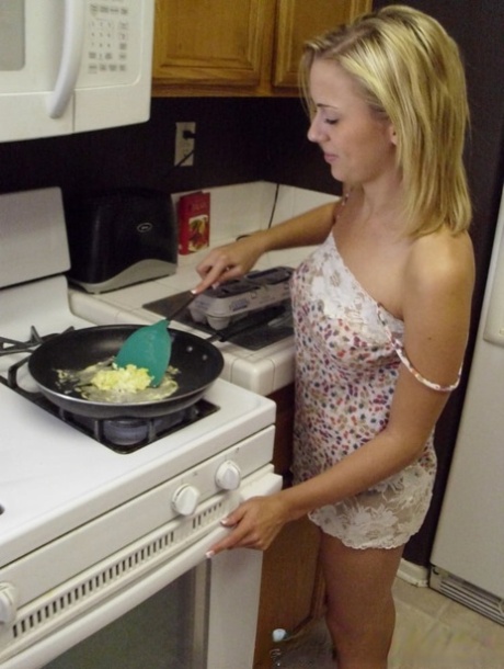 Pretty amateur wife Katty West strips and shows her big tits while cooking